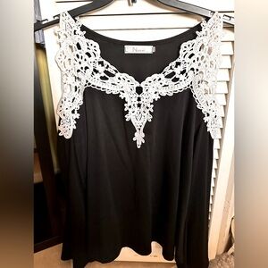 NUOXI Black & White cold shoulder lace cutout top.